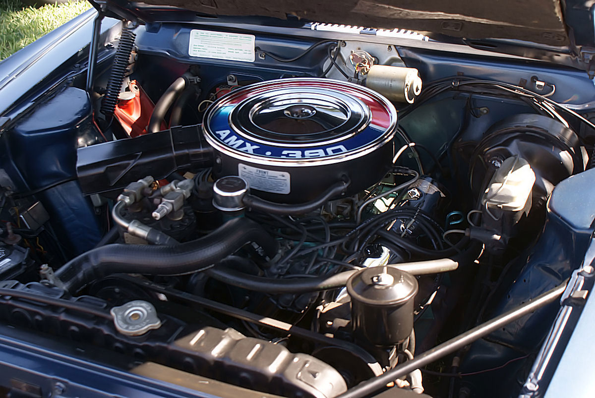 The 390 V8 in a blue 1969 AMC AMX, with the round AMX 390 air cleaner
