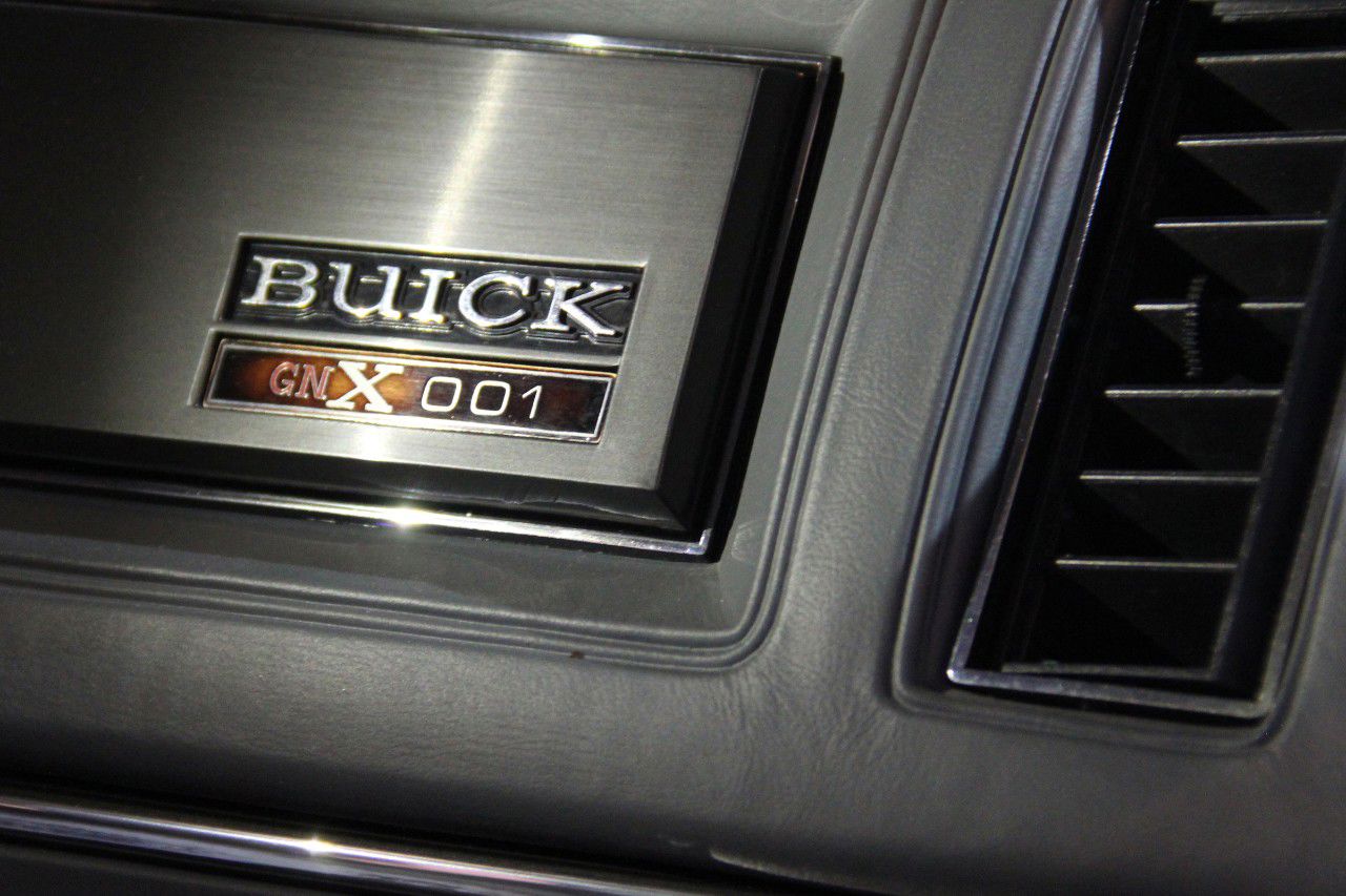 Dashboard plaque on a 1987 Buick GNX with the Buick name and the serial number GNX 001