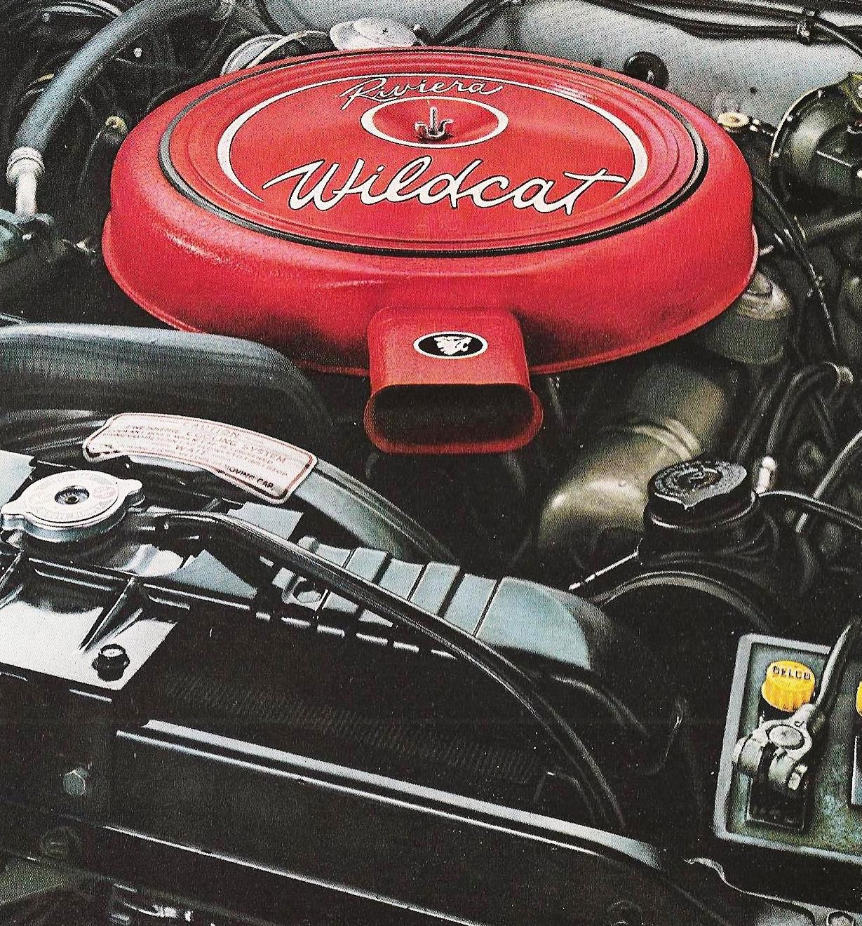 Brochure photo of the 1963 Riviera engine bay with a red air cleaner lettered Riviera and Wildcat