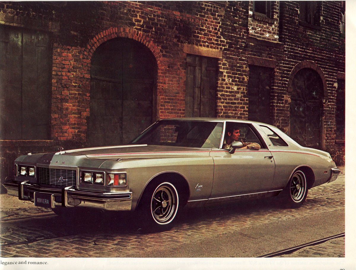 Brochure page: silver 1976 Riviera coupe, front three-quarter, on cobblestones before a brick building