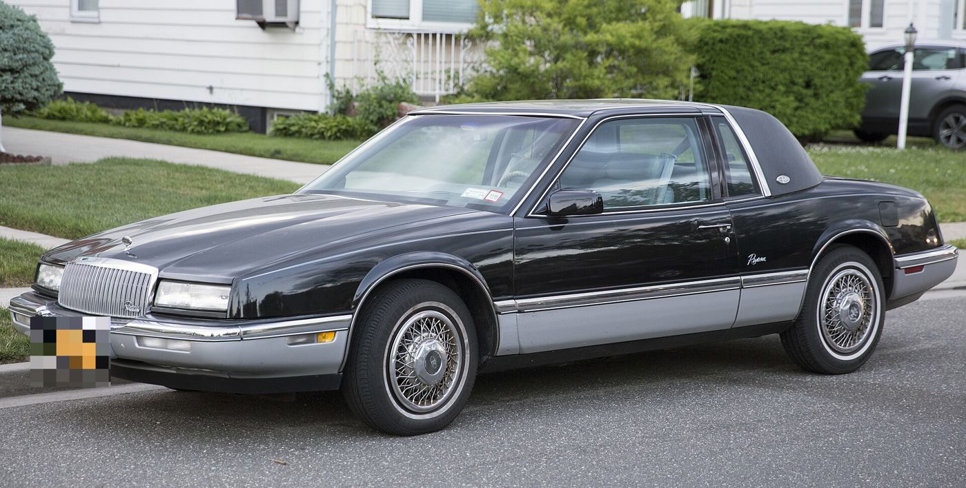 Black 1990 Buick Riviera coupe with wire wheels, front three-quarter