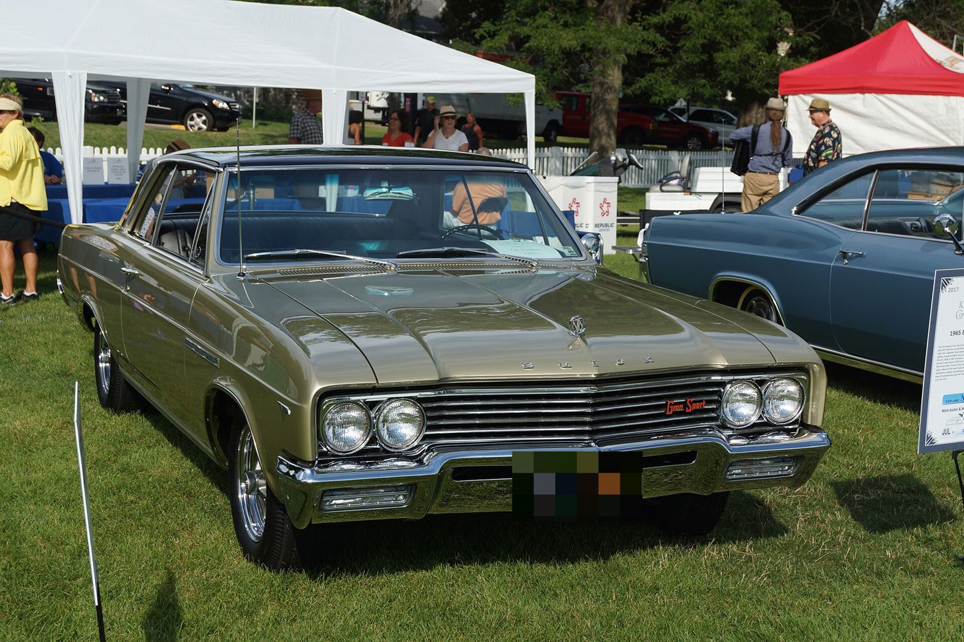 Olive 1965 Buick Skylark Gran Sport hardtop, front three-quarter, at a car show