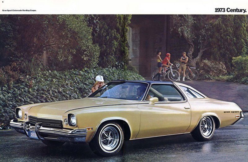 Brochure page: gold 1973 Century Gran Sport colonnade coupe, front three-quarter, with cyclists behind