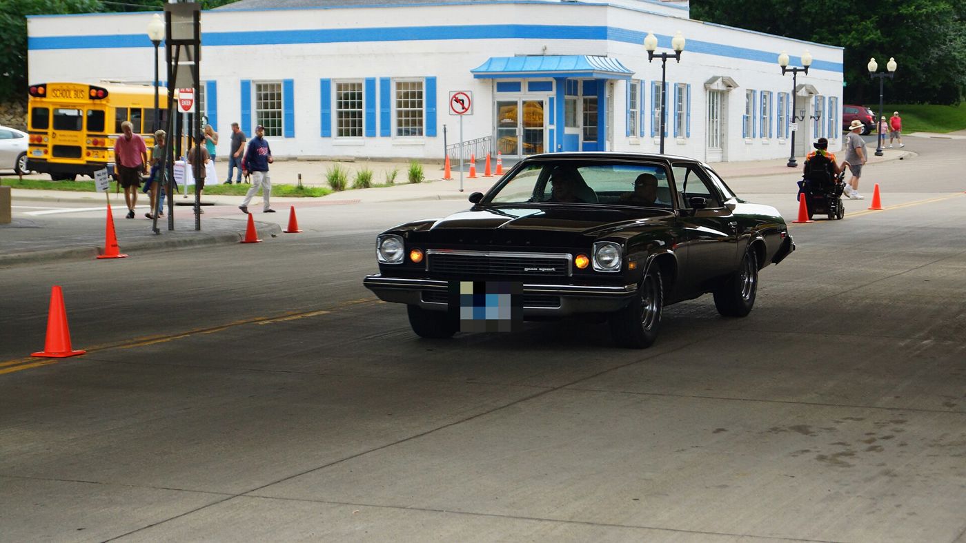 Black 1974 Buick Century Gran Sport colonnade coupe driving through a cone course
