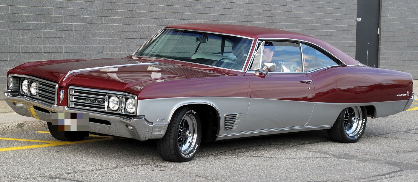 Maroon-over-silver 1968 Buick Wildcat two-door hardtop, front three-quarter, in a parking lot