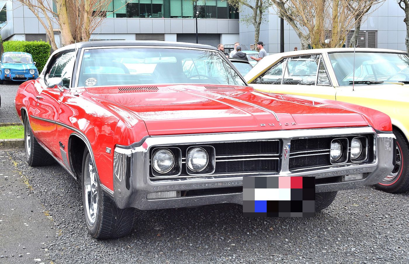 Red 1969 Buick Wildcat two-door hardtop, front view, at a car show
