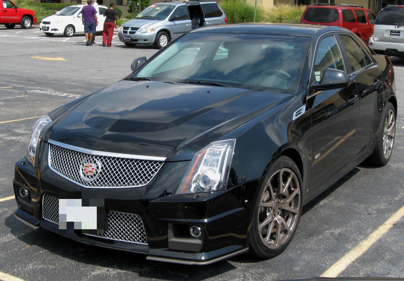 Black 2009 Cadillac CTS-V sedan, front three-quarter, in a parking lot
