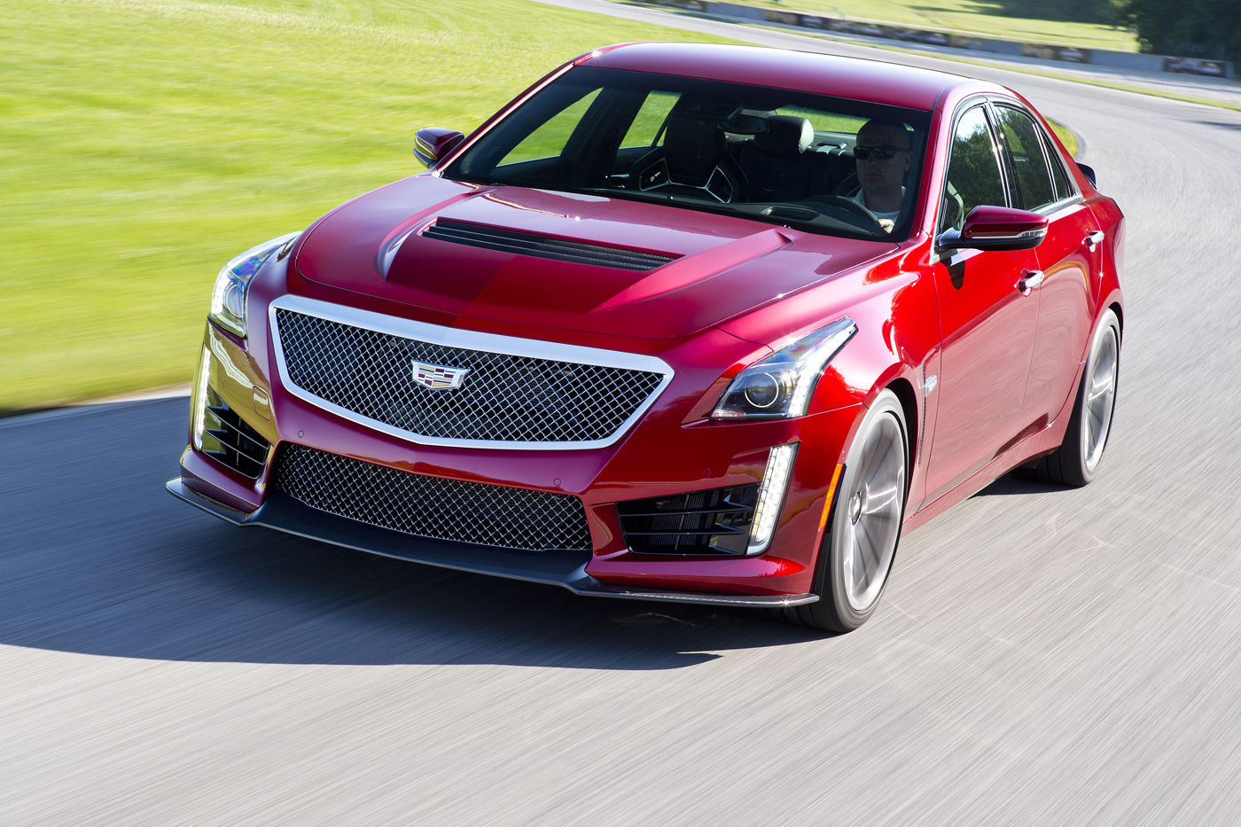 Red 2016 Cadillac CTS-V sedan cornering on a racetrack