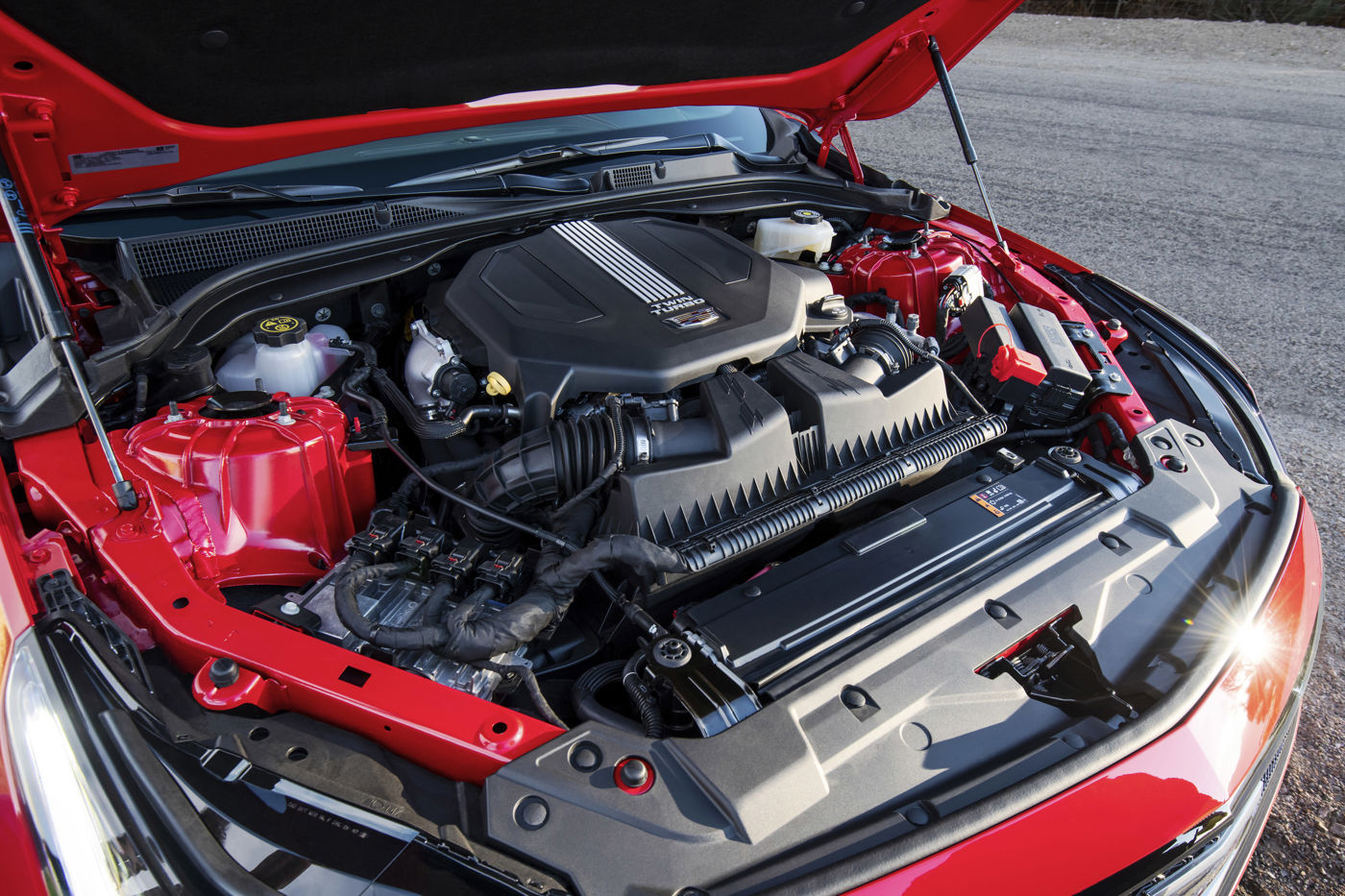 Open engine bay of a red 2020 Cadillac CT5-V showing the twin-turbocharged V-6