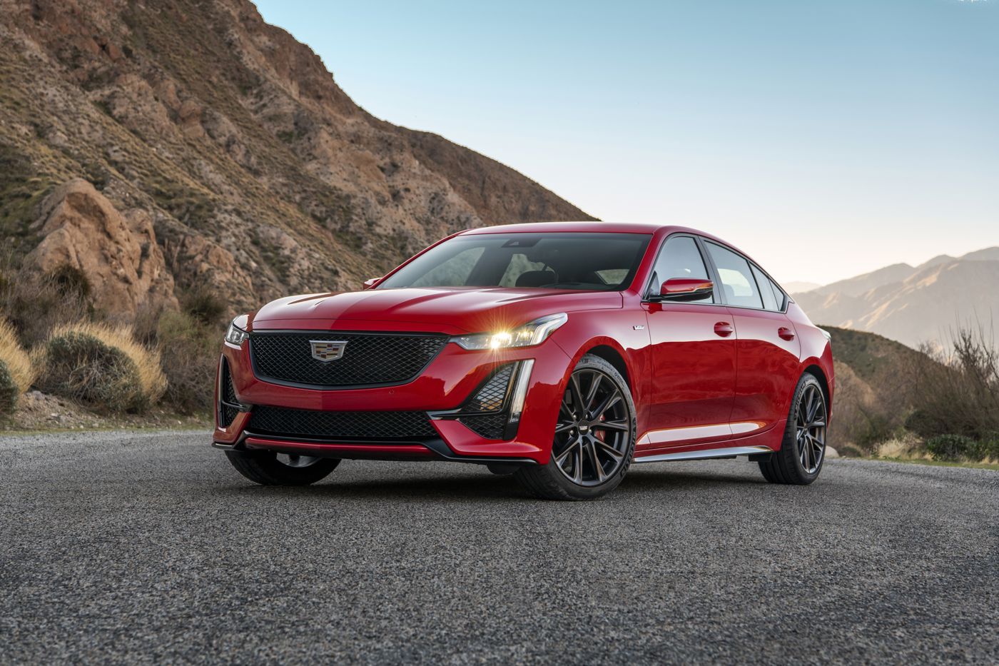 Red 2020 Cadillac CT5-V sedan, front three-quarter, on a mountain road