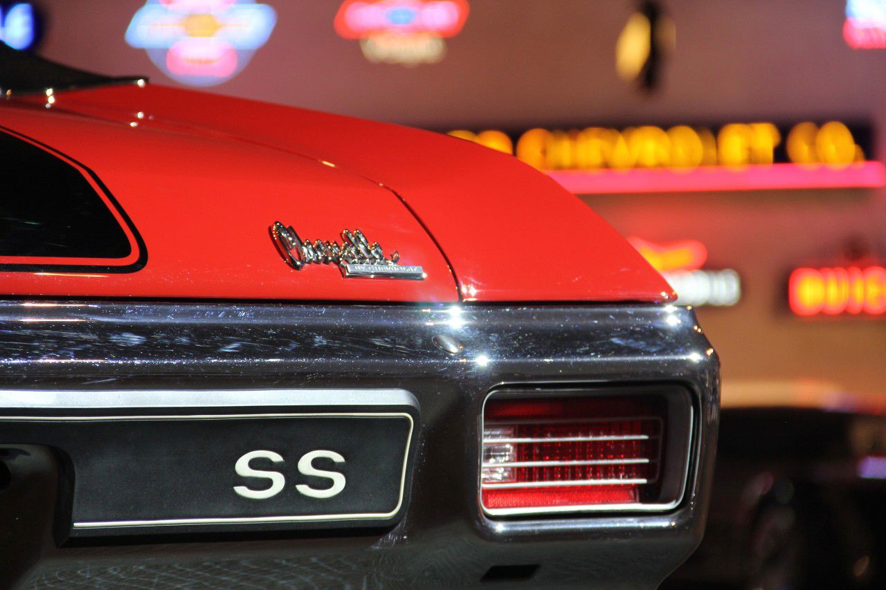 Close-up of the rear of a red 1970 Chevrolet Chevelle SS showing the black SS panel in the bumper, the taillamp set into the bumper and the Chevelle script on the trunk lid