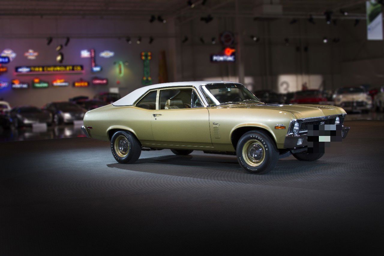 Gold 1970 Chevrolet Nova SS two-door coupe with white vinyl roof, SS grille badge, 396 fender badge and gold-painted wheels, in the GM Heritage Center hall