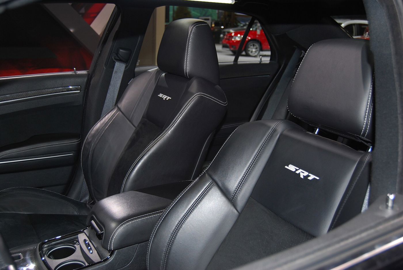 Black leather front seats with embroidered SRT logos in a second-generation Chrysler 300 SRT8