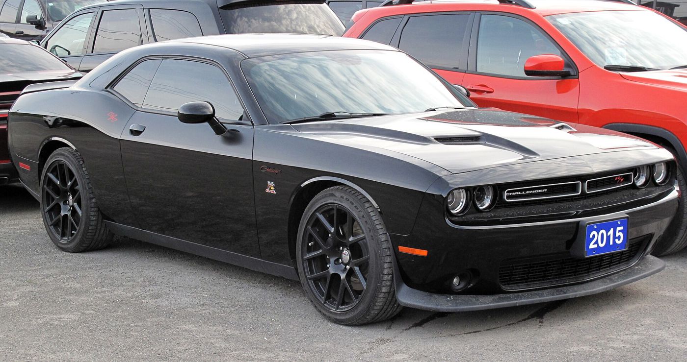 Black 2015 Dodge Challenger R/T Scat Pack with the 2015-on split grille and Scat Pack bee badge, front three-quarter