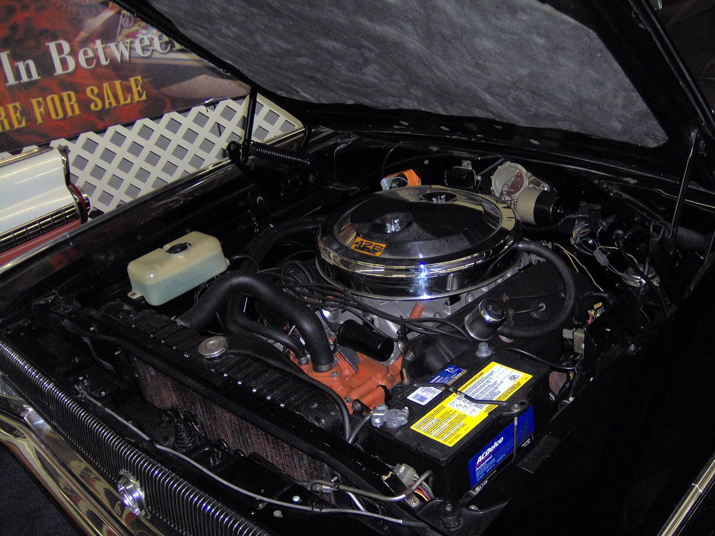 Engine bay of a 1966 Dodge Charger showing the 426 Hemi V8 with its twin four-barrel air cleaner