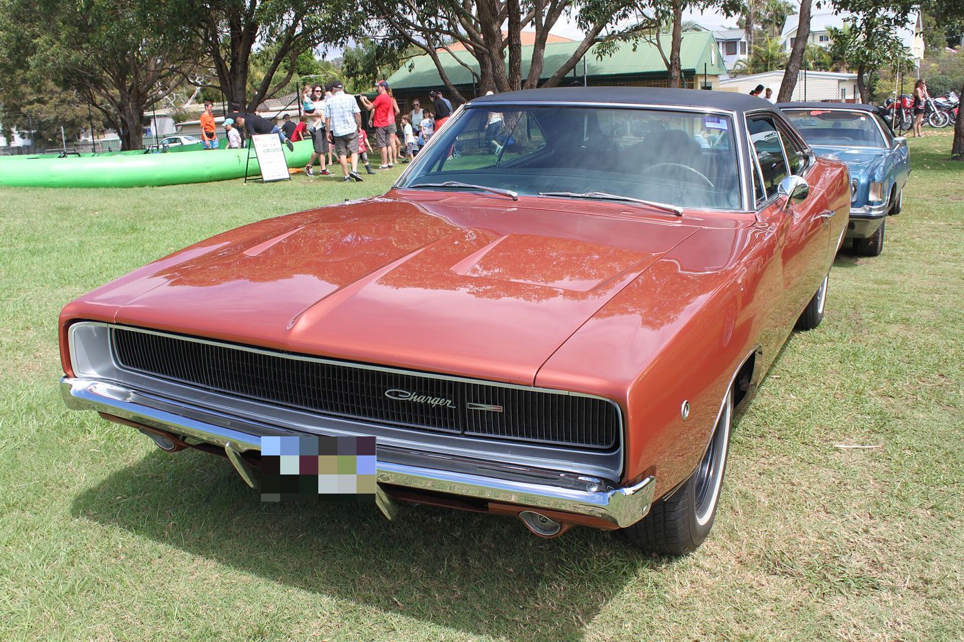 Copper-red 1968 Dodge Charger with black vinyl roof and R/T grille badge, front three-quarter view
