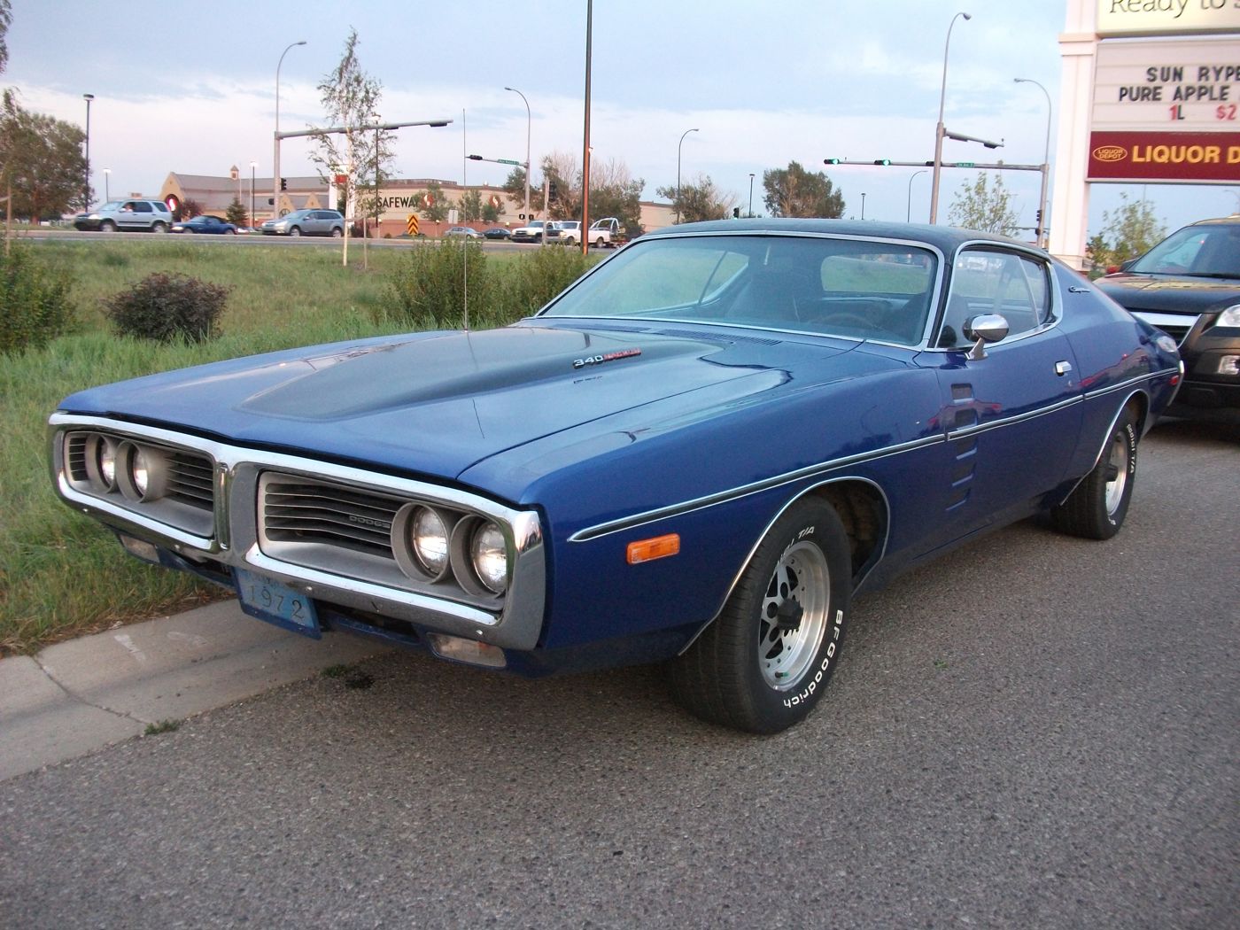 Blue 1972 Dodge Charger Rallye from the front three-quarter with pinstriping and a power-bulge hood