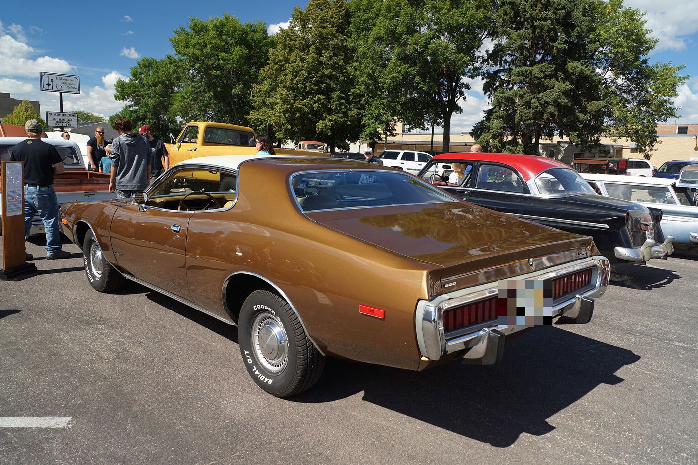 Bronze 1973 Dodge Charger from the rear three-quarter showing its slotted taillamps