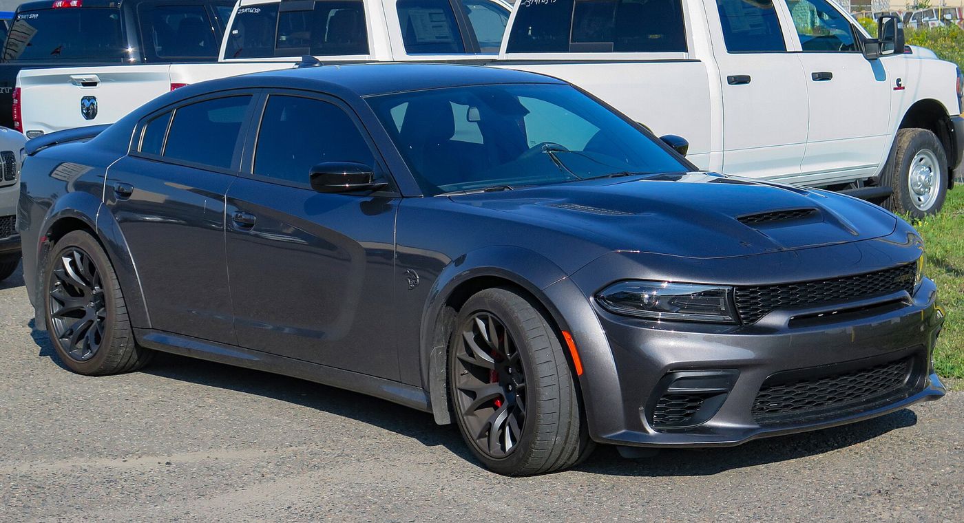 Dark grey 2023 Dodge Charger SRT Hellcat Widebody with flared fenders, front three-quarter view