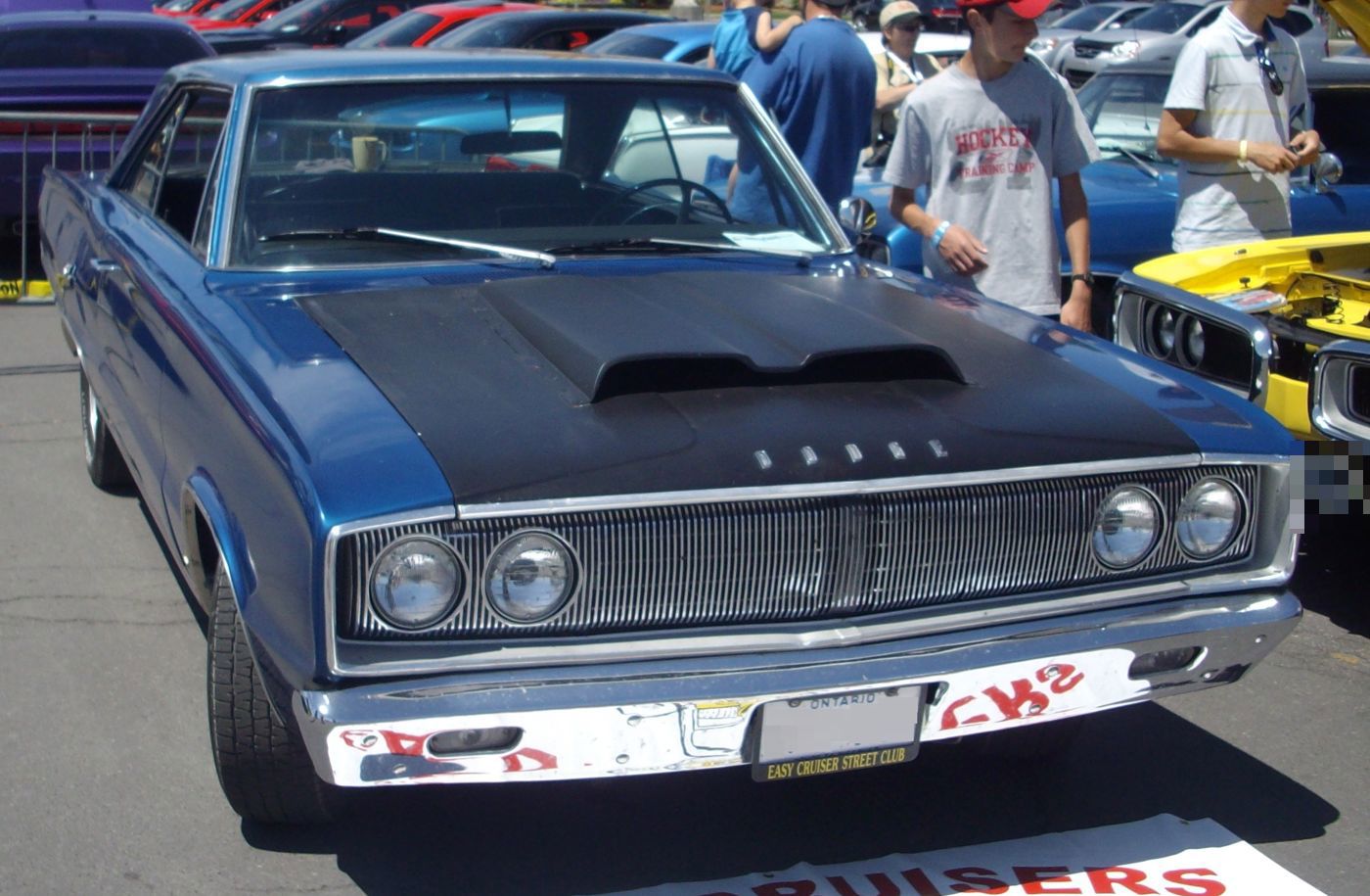 Blue 1967 Dodge Coronet R/T with black hood, the R/T-only full-width grille and quad headlamps