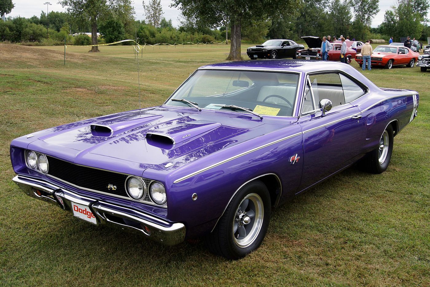 Purple 1968 Dodge Coronet R/T with twin hood power bulges and R/T grille badge, front three-quarter