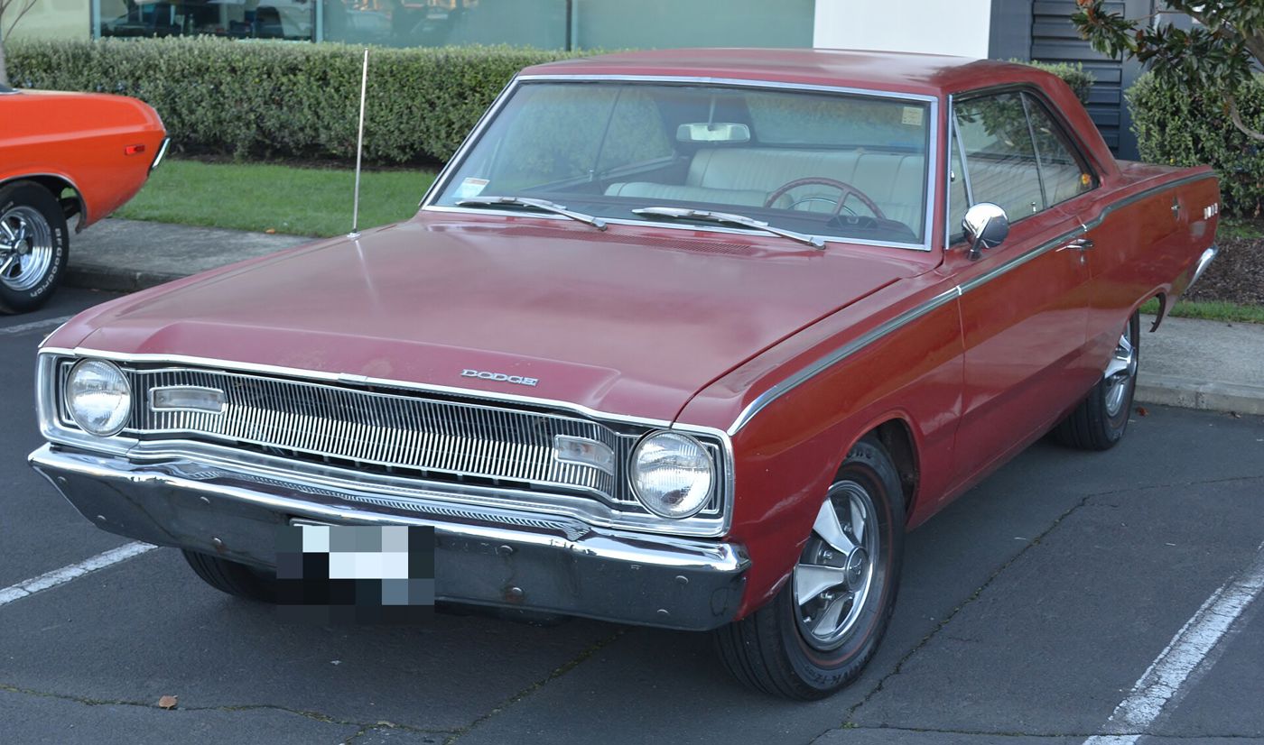 Red 1967 Dodge Dart two-door hardtop from the front three-quarter, with its wide horizontal grille