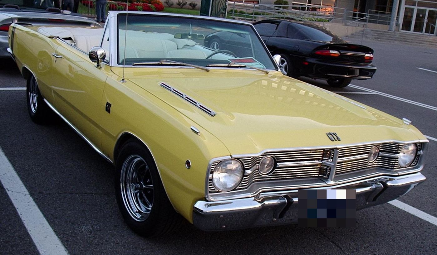 Yellow 1968 Dodge Dart GTS convertible with hood louvres and the GTS grille, top down