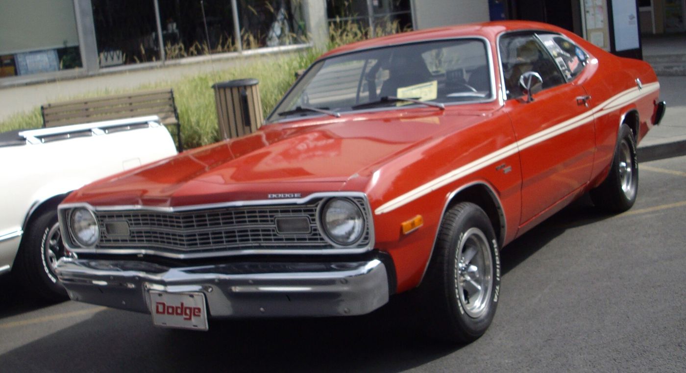 Red 1974 Dodge Dart Sport with white side stripe, front three-quarter