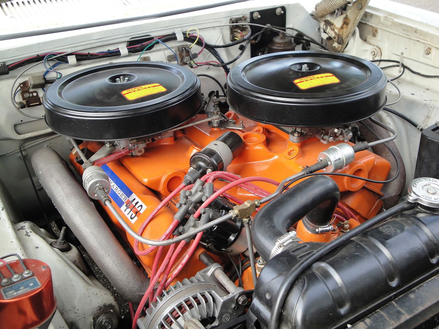 Orange Ramcharger 413 V8 in a 1962 Dodge Dart 330, with two black air cleaners on the long-ram intake manifold