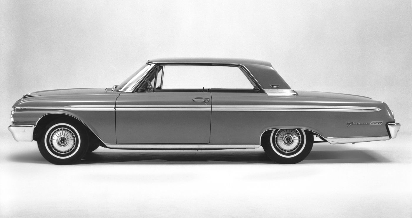 Black-and-white studio side profile of a 1962 Ford Galaxie 500XL two-door hardtop, with 500XL lettering on the rear fender