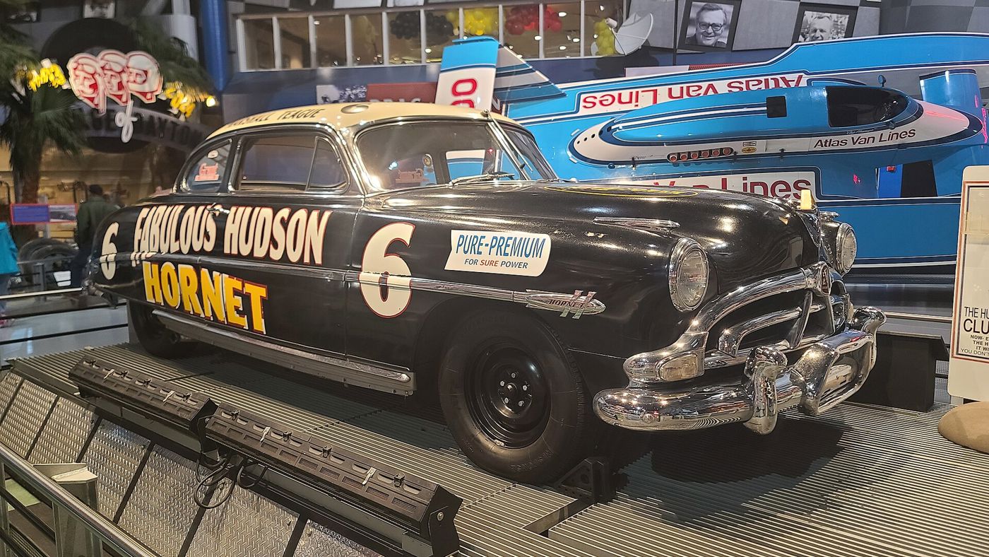 Black Hudson Hornet stock car with number 6 and FABULOUS HUDSON HORNET lettering on display