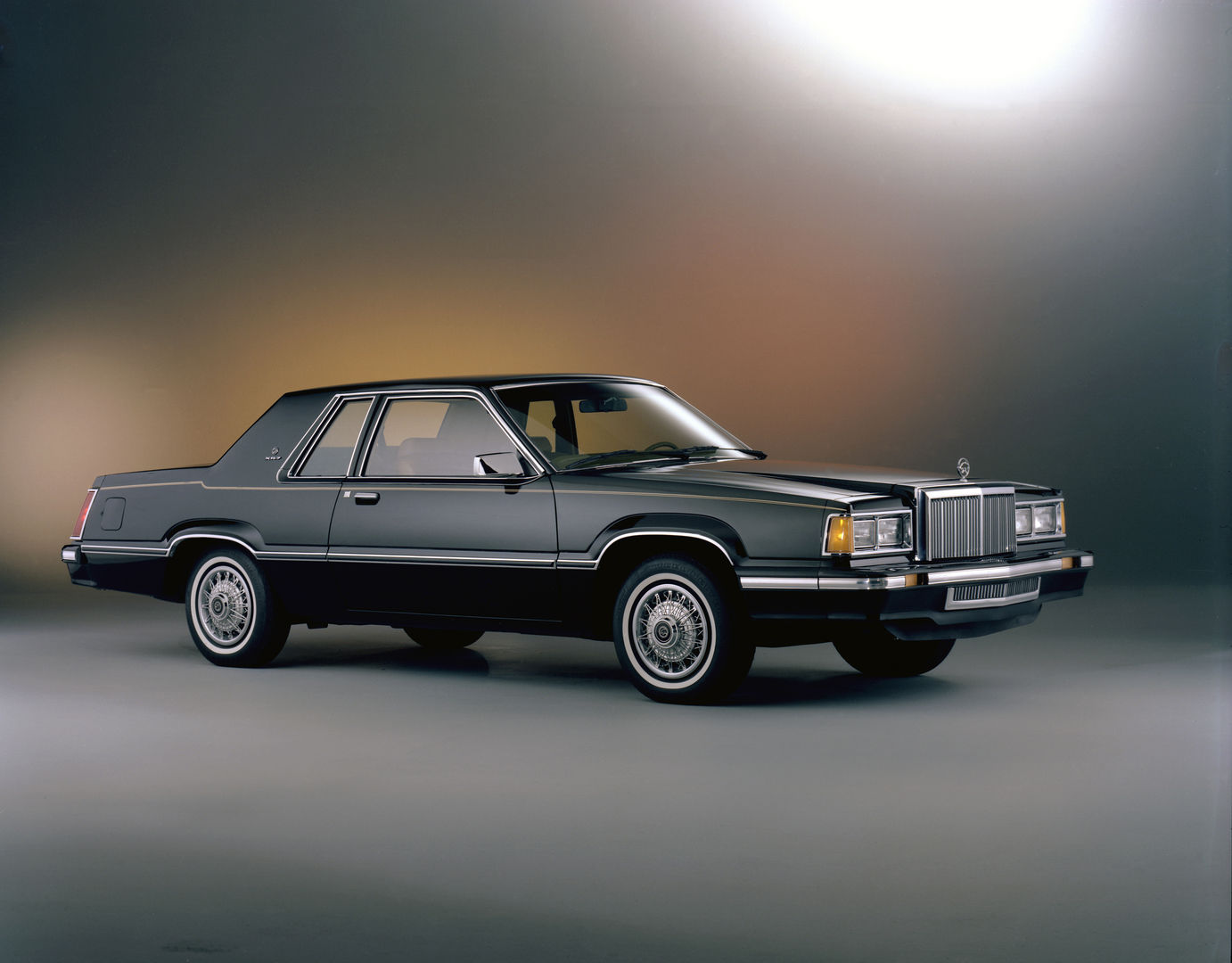 Black 1981 Mercury Cougar XR-7 coupe, front three-quarter studio view with an upright chrome grille