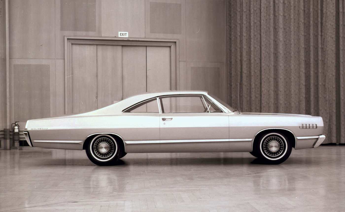 Sepia studio photo of a 1967 Mercury Monterey two-door fastback hardtop in full side profile, with Monterey lettering on the rear fender