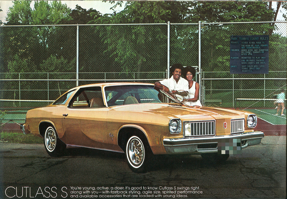 Brochure page: gold 1975 Cutlass S coupe, front three-quarter, by a tennis court