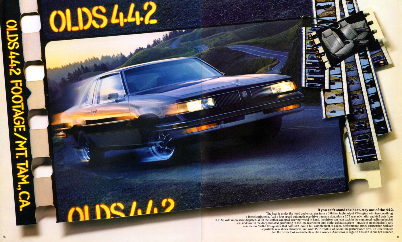 Brochure spread styled as film footage: dark 1987 Olds 4-4-2 coupe on a mountain road, headed "Olds 4-4-2"