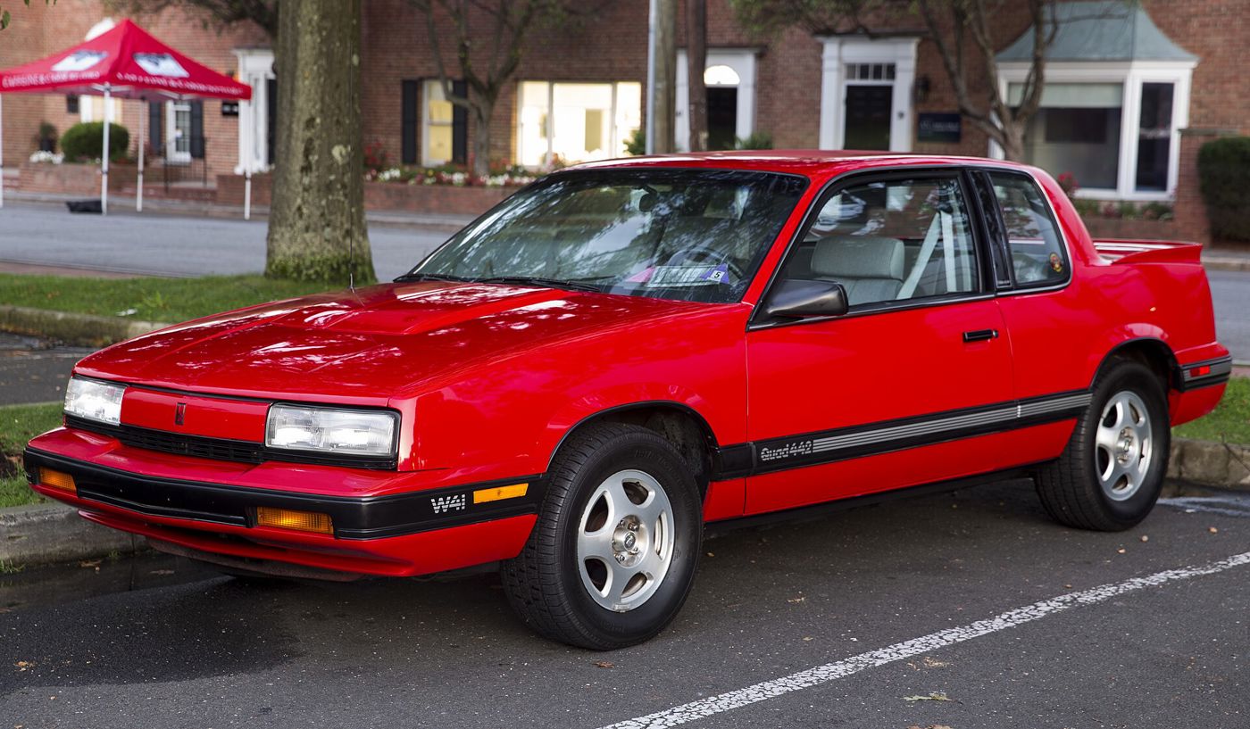 Bright red 1991 Oldsmobile Cutlass Calais Quad 4-4-2 W41 coupe, front three-quarter