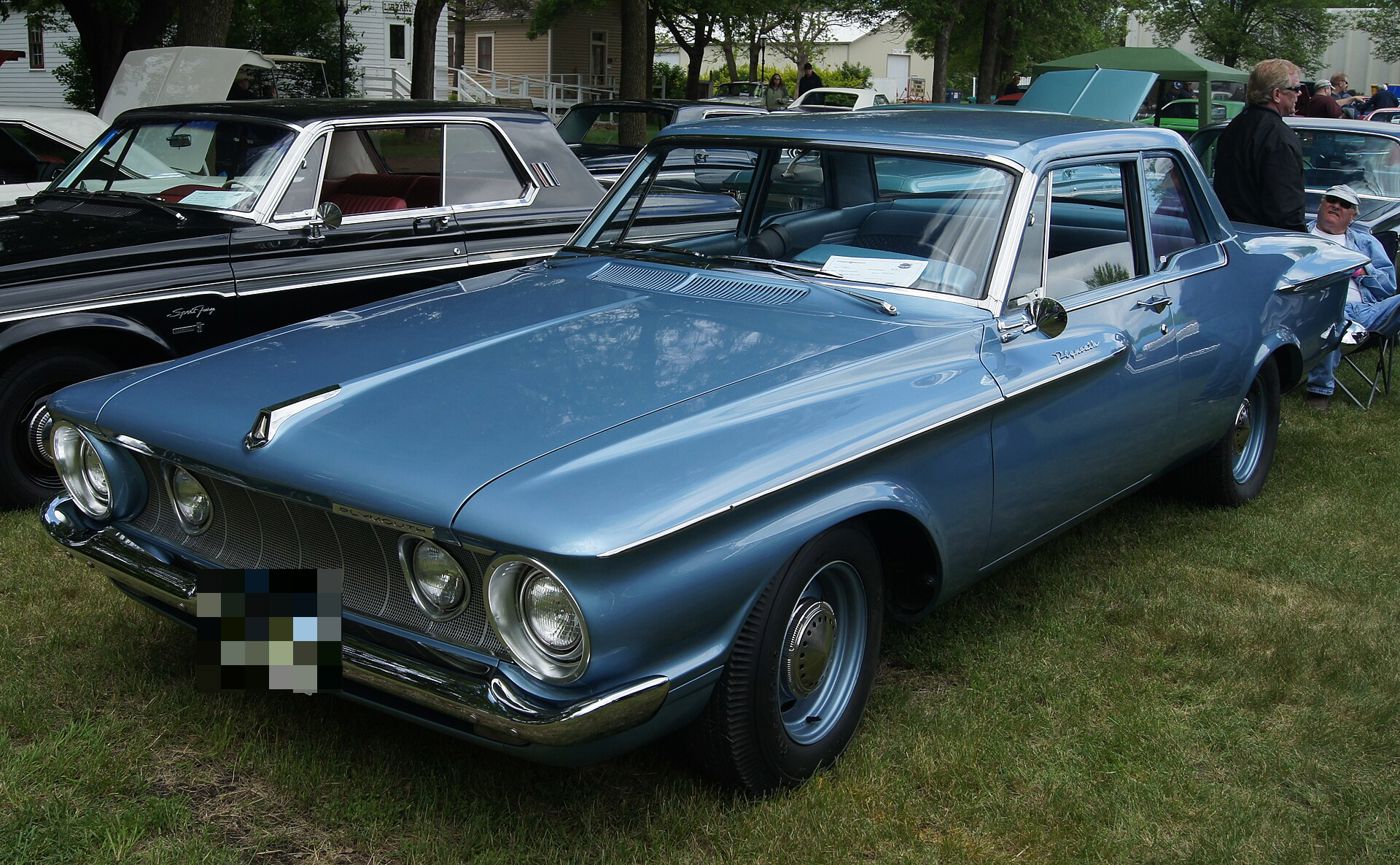 Blue 1962 Plymouth Savoy from the front three-quarter, showing the 1962 downsized body and eye-shaped headlamp bezels