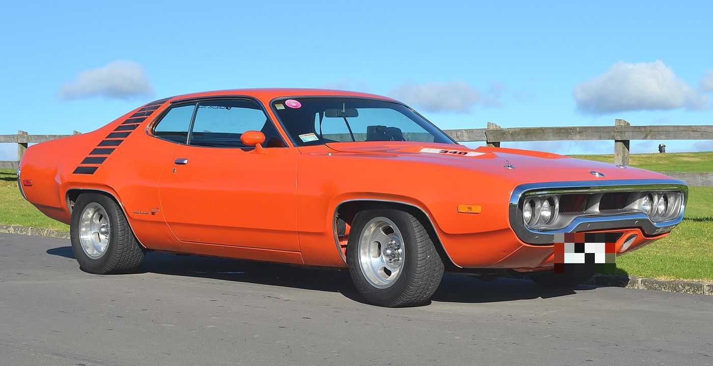 Orange 1972 Plymouth Road Runner in profile, showing the fuselage body, loop bumper grille and quarter-panel strobe stripe