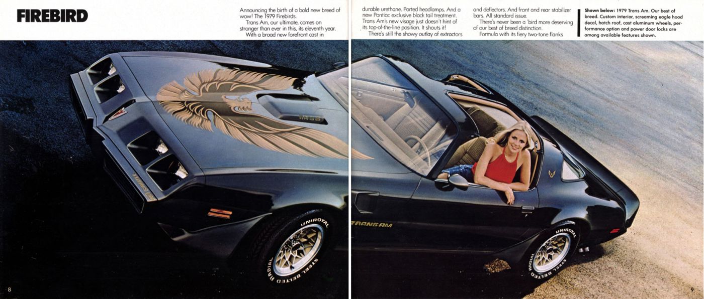 Overhead view of a black 1979 Trans Am with its large gold hood bird and T-tops, a woman at the wheel