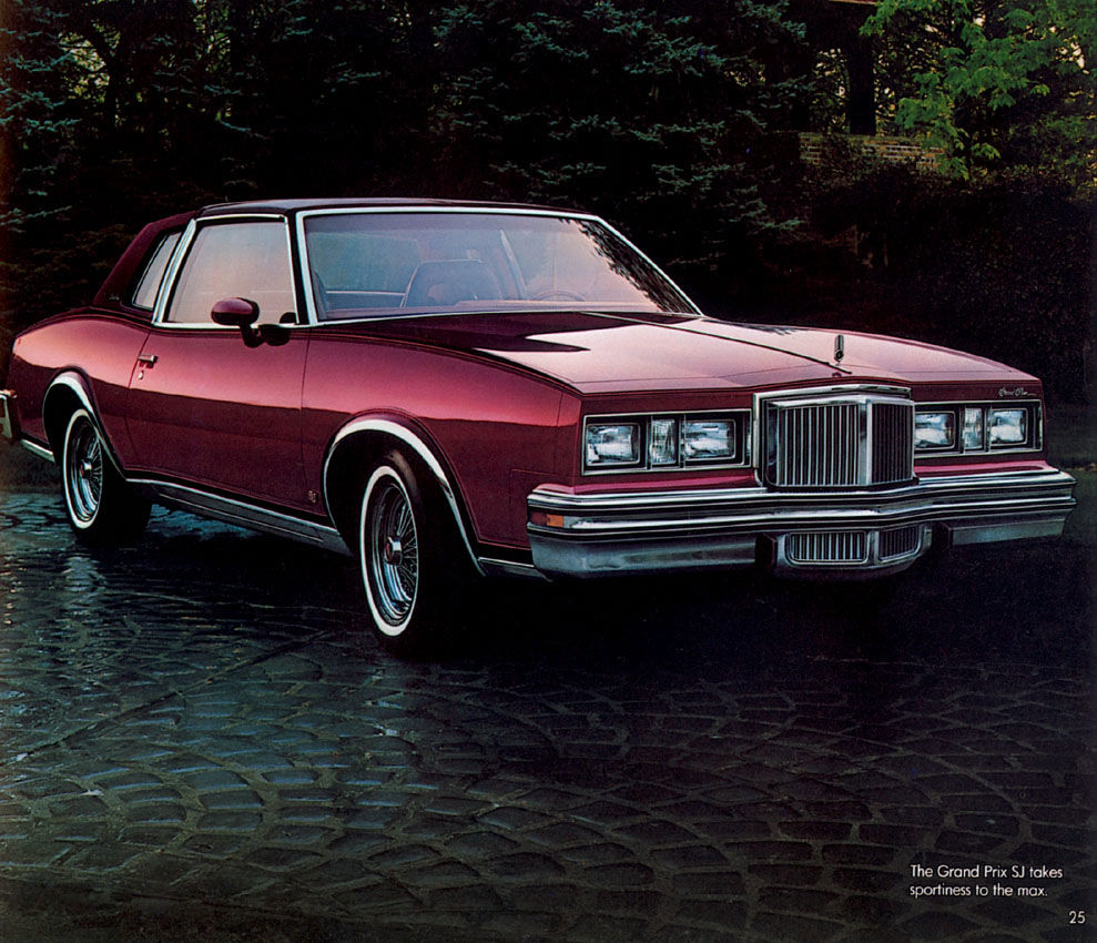 Dark red 1980 Grand Prix SJ coupe front three-quarter on wet cobblestones
