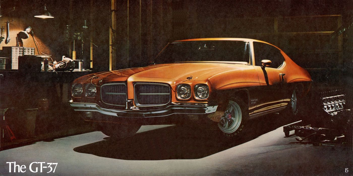 Orange 1971 GT-37 hardtop with stripes and Rally II wheels in a dim garage, under the title The GT-37