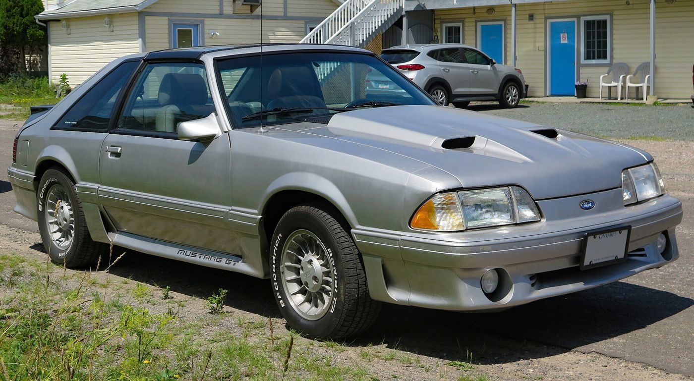 Light gray 1987 Mustang GT hatchback with Mustang GT rocker lettering, front three-quarter
