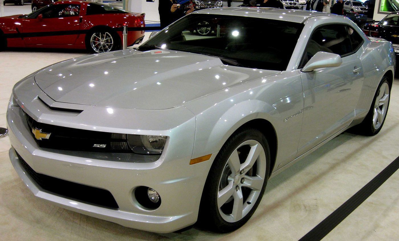 Silver 2010 Chevrolet Camaro SS with SS grille badge, front three-quarter at an auto show