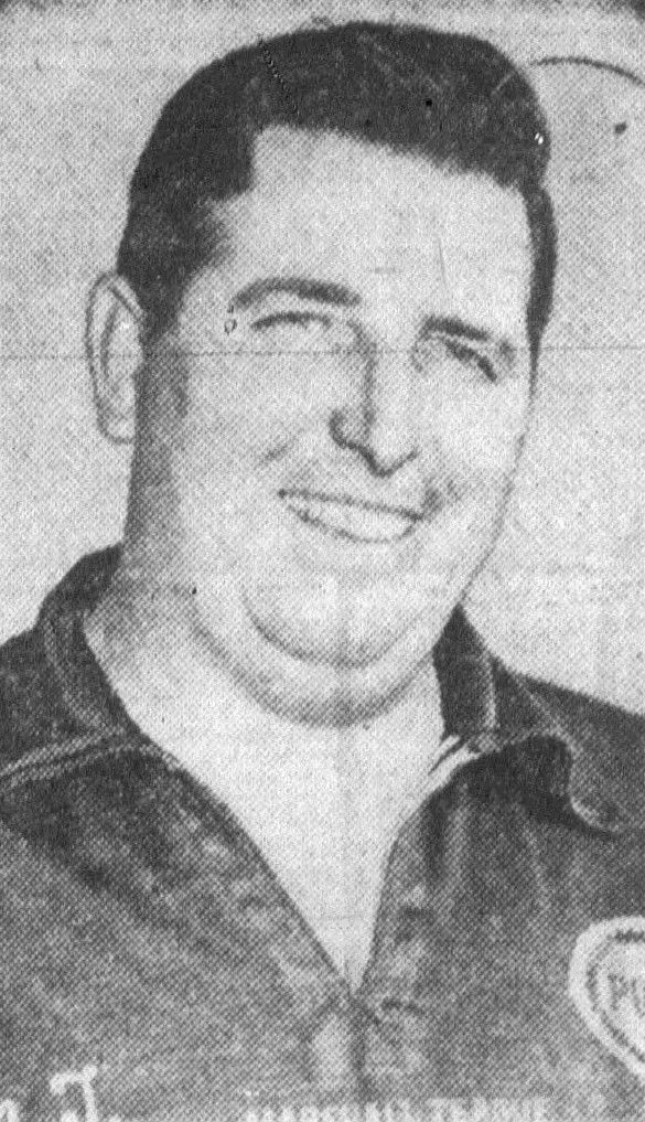 Newspaper halftone portrait of Marshall Teague smiling, wearing a dark jacket